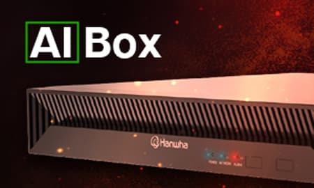 Hanwha Vision AI Box hardware device with "AI Box" label and glowing background.
